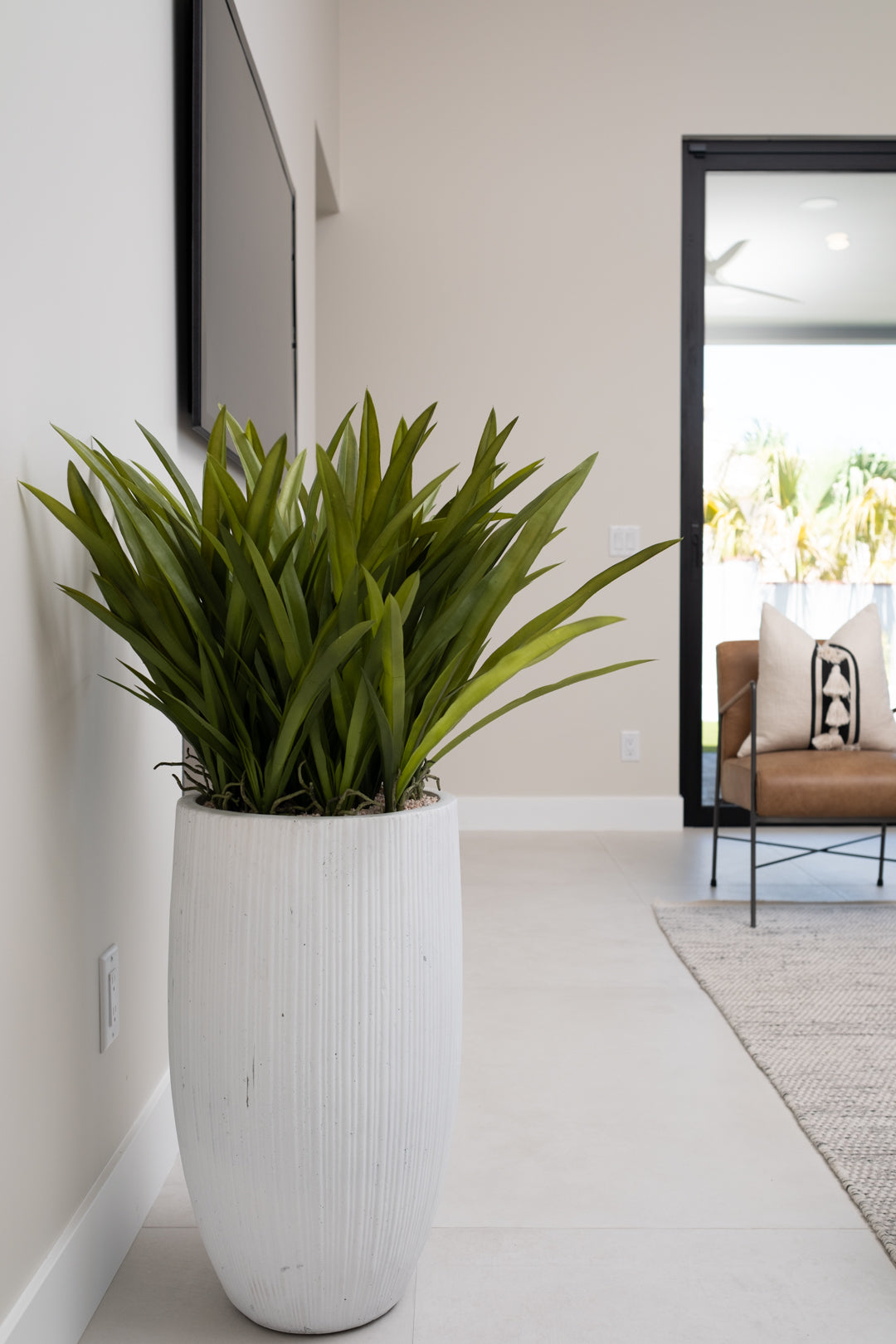 ORCHID LEAVES IN TALL PLANTER