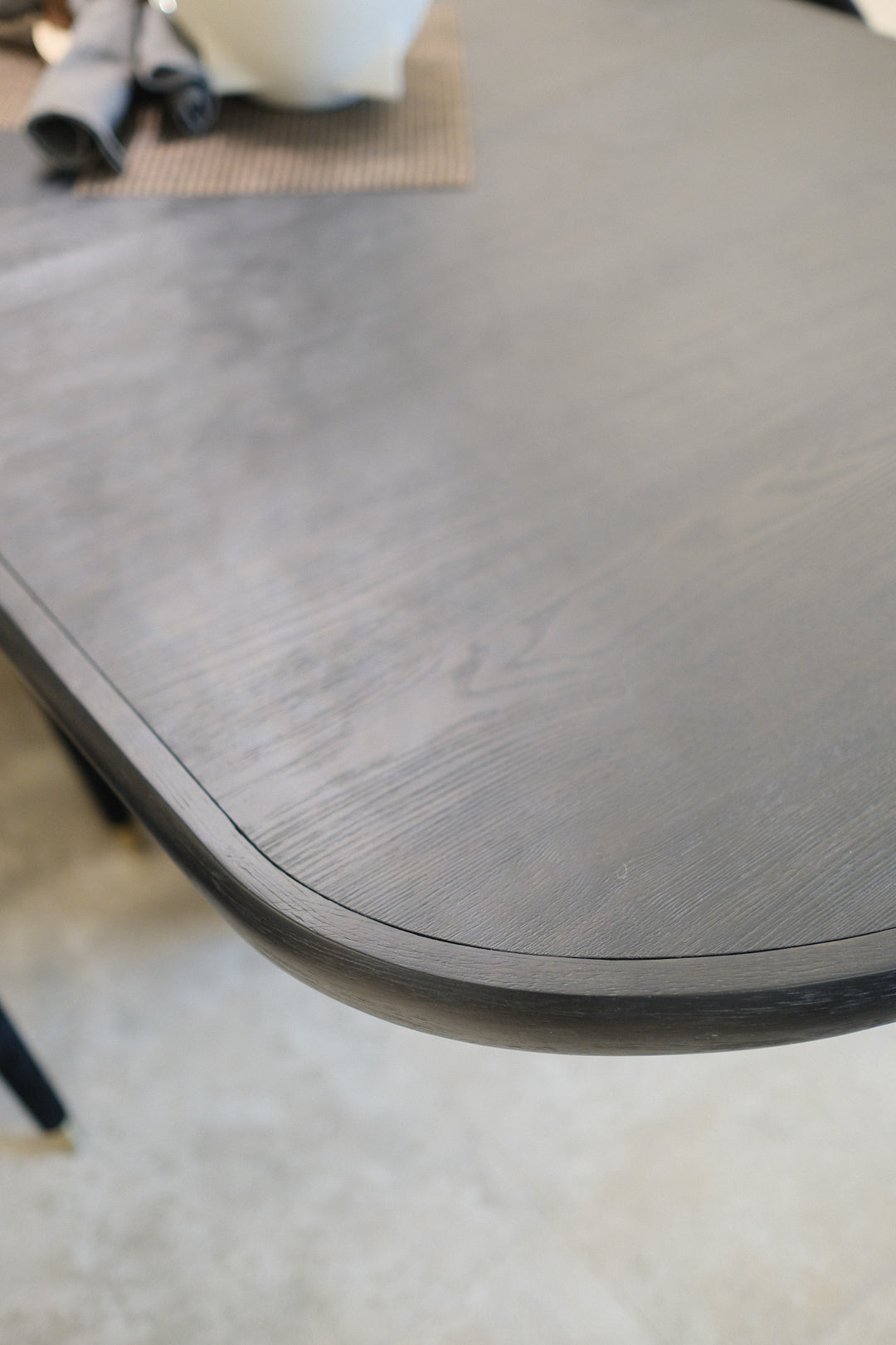77.75-95.75IN BLACK DINING TABLE